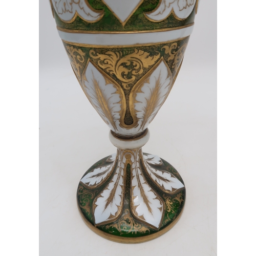 2263 - A PAIR OF BOHEMIAN WHITE OVERLAY GREEN GLASS VASESof typical urn shape, with painted gilt scrolling ... 