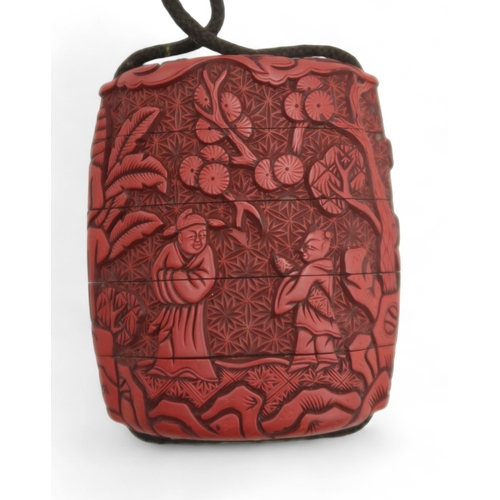 2457 - A JAPANESE RED LAQUERED INRO AND OJIMECarved in fine detail with figures beneath pine trees,the ojim... 