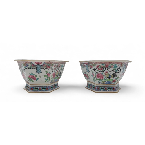 2461 - A PAIR OF SAMSON HEXAGONAL JARDINIERES Painted in the Chinese famille rose style, with cockerels and... 