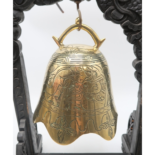 2462 - A CHINESE BRASS TABLE BELL Hung on a dragon shaped ebonised stand,50cm high and a brass vase cast wi... 