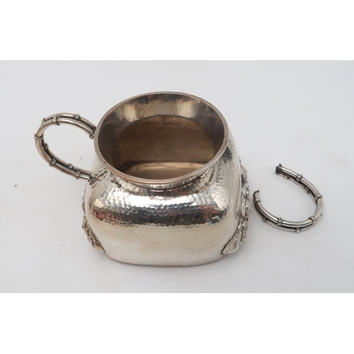 2470 - A JAPANESE SILVER TEA SERVICECast with coiled dragons on a hammered ground, signed, teapot, 13cm hig... 