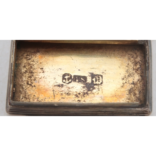 2548F - A GEORGE IV SILVER VINAIGRETTEmaker's mark TS, Birmingham 1827, of rectangular form, the body with e... 