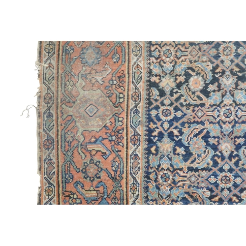 2158 - A DARK GROUND MAHAL RUG with multicoloured geometric patterned ground within terracotta geometr... 