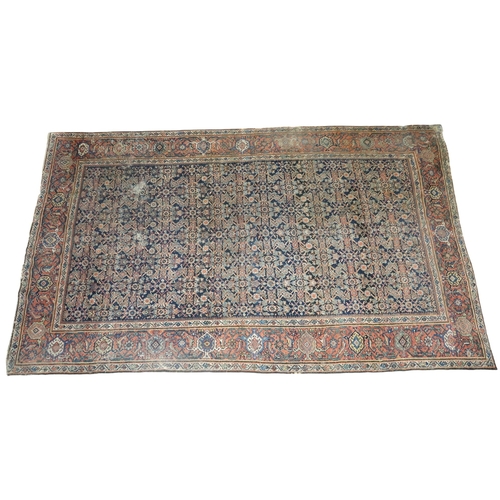 2158 - A DARK GROUND MAHAL RUG with multicoloured geometric patterned ground within terracotta geometr... 