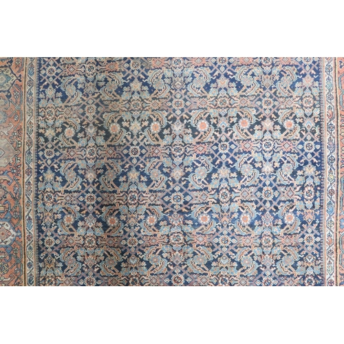 2158 - A DARK GROUND MAHAL RUG with multicoloured geometric patterned ground within terracotta geometr... 