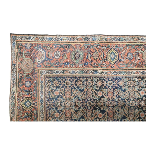 2158 - A DARK GROUND MAHAL RUG with multicoloured geometric patterned ground within terracotta geometr... 