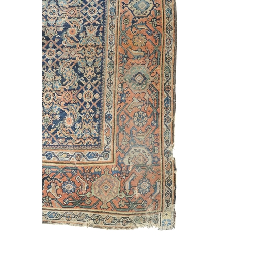 2158 - A DARK GROUND MAHAL RUG with multicoloured geometric patterned ground within terracotta geometr... 