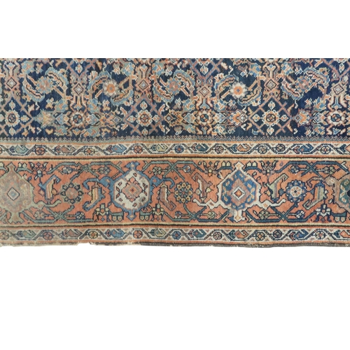 2158 - A DARK GROUND MAHAL RUG with multicoloured geometric patterned ground within terracotta geometr... 