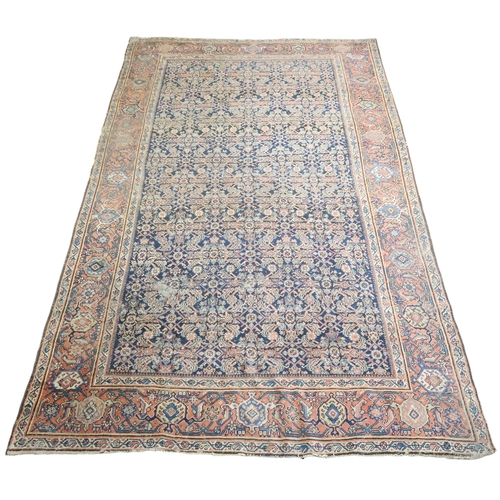 2158 - A DARK GROUND MAHAL RUG with multicoloured geometric patterned ground within terracotta geometr... 