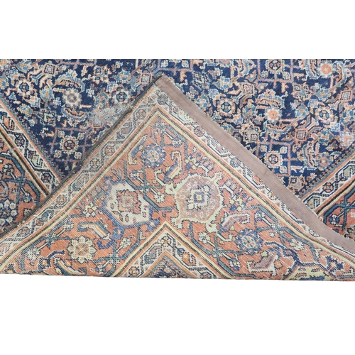 2158 - A DARK GROUND MAHAL RUG with multicoloured geometric patterned ground within terracotta geometr... 