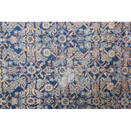 2158 - A DARK GROUND MAHAL RUG with multicoloured geometric patterned ground within terracotta geometr... 