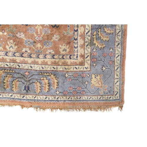 2159 - A TERRACOTTA GROUND PERSIAN ZIEGLER RUG with geometric foliate patterned ground within blue geo... 