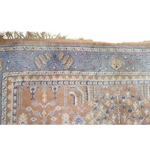 2159 - A TERRACOTTA GROUND PERSIAN ZIEGLER RUG with geometric foliate patterned ground within blue geo... 