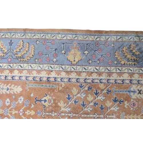 2159 - A TERRACOTTA GROUND PERSIAN ZIEGLER RUG with geometric foliate patterned ground within blue geo... 