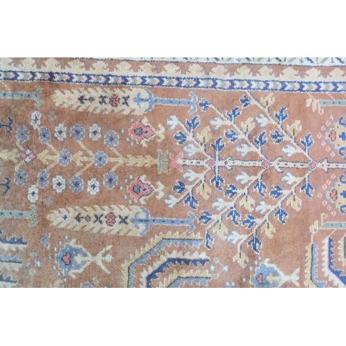 2159 - A TERRACOTTA GROUND PERSIAN ZIEGLER RUG with geometric foliate patterned ground within blue geo... 