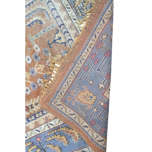 2159 - A TERRACOTTA GROUND PERSIAN ZIEGLER RUG with geometric foliate patterned ground within blue geo... 