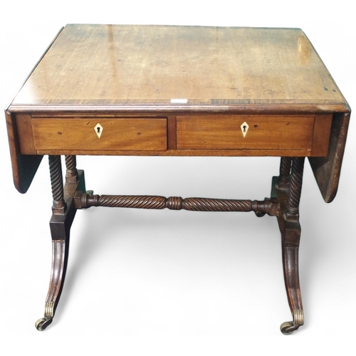 22 - A 19th century mahogany drop end sofa table with two drawers on spiral supports with down swept feet... 