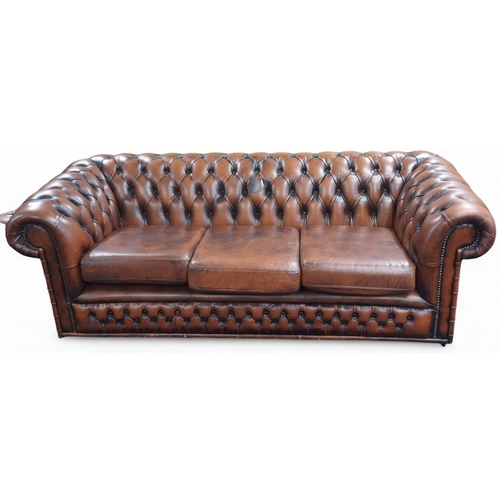 55 - A 20th century brown leather upholstered button upholstered Chesterfield style club settee, 65cm hig... 