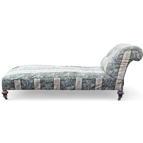 57 - A Victorian floral upholstered day bed/ chaise with button upholstered backrest on turned supports t... 