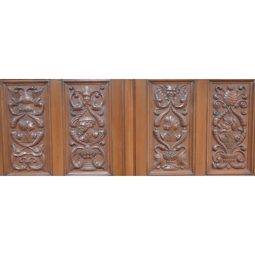 7 - A 20th century painted oak wardrobe with moulded cornice over pair of panelled doors carved with pai... 