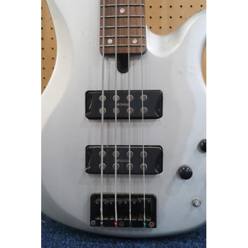 477 - A Yamaha RBX-374 electric bass guitar, with 24 frets and a silver double cutaway body