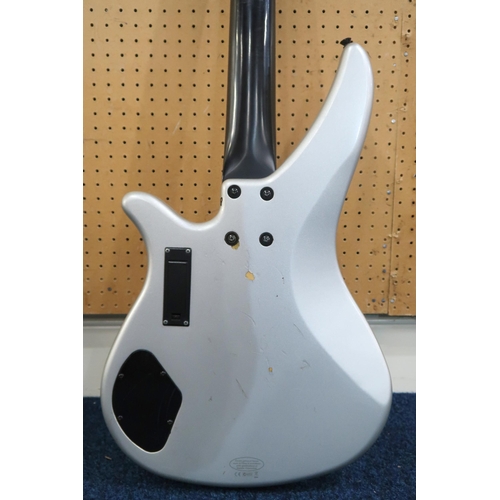 477 - A Yamaha RBX-374 electric bass guitar, with 24 frets and a silver double cutaway body