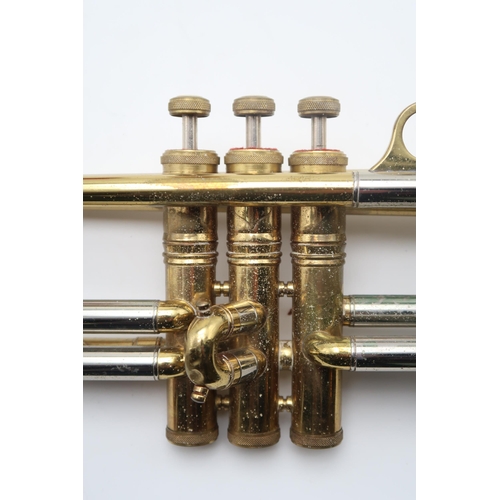 483 - A Brass Two-Tone Selmer Invicta trumpet in case, with a mouthpiece and two moulded mutes