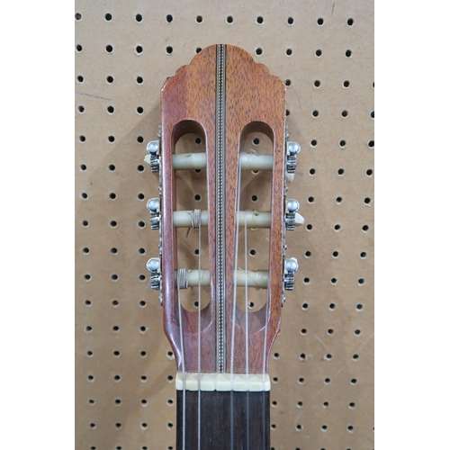 486 - A vintage NANYO classical guitar, Model no. 1683, hand made in Japan, with a vintage hard case. Also... 