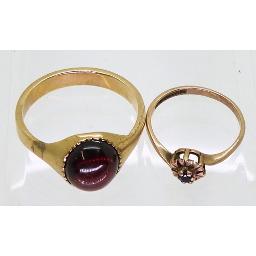 710 - A yellow metal garnet ring, size Y1/2, together with a 9ct gold sapphire ring, size M1/2 weight 7.3g... 