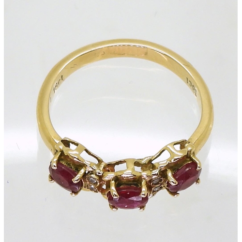 711 - An 18ct gold ruby and diamond dress ring, size O, weight 3.8gms