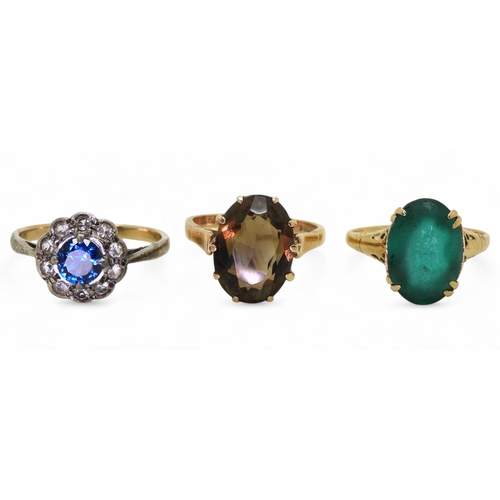 717 - A 9ct smoky quartz ring, size M1/2, a 9ct green glass ring, size O1/2 (af) and a yellow and white me... 