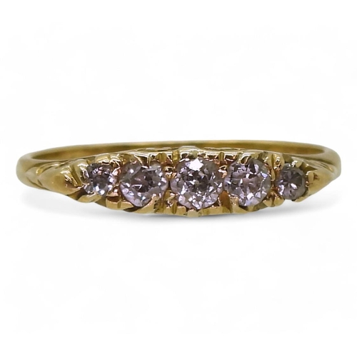 720 - An 18ct gold five stone diamond ring in a scroll mount, set with estimated approx 0.15cts of brillia... 