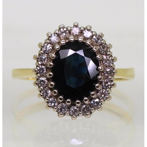 725 - An 18ct gold sapphire and diamond cluster ring, size N, weight 4.1gms