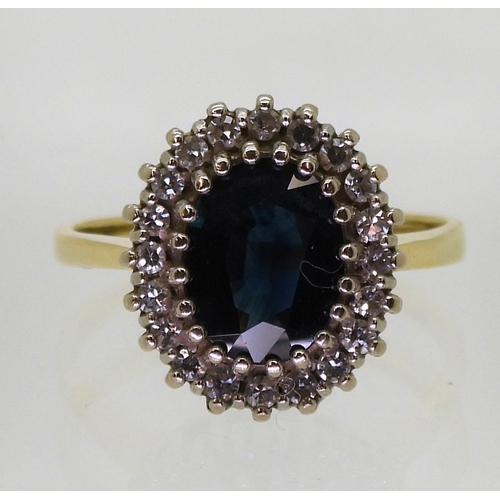 725 - An 18ct gold sapphire and diamond cluster ring, size N, weight 4.1gms