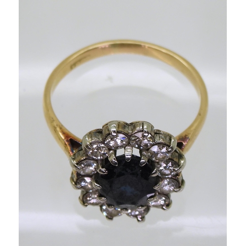 727 - An 18ct gold sapphire and diamond classic cluster ring, set with estimated approx 0.60cts of brillia... 