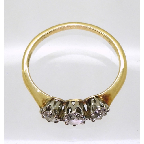 729 - An 18ct gold three stone diamond ring, set with three old cut diamonds with an estimated approx diam... 