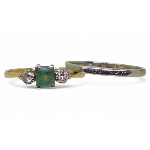 730 - An emerald and diamond three stone ring, in bright yellow and white metal set with an (af) step cut ... 