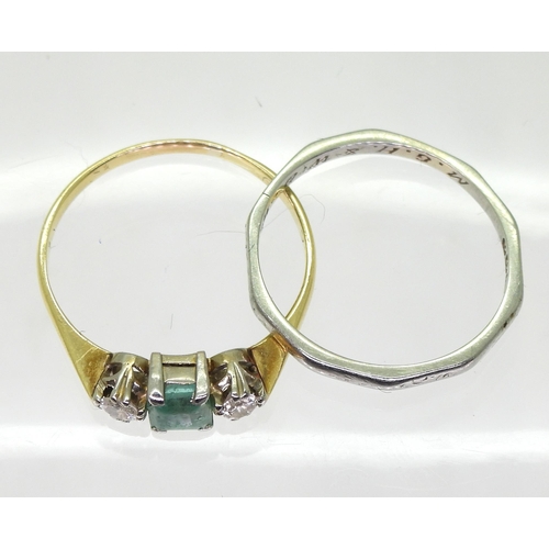 730 - An emerald and diamond three stone ring, in bright yellow and white metal set with an (af) step cut ... 