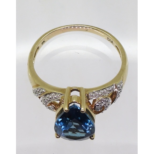 733 - A 9ct gold London blue topaz and diamond accent ring, size Q,  weight 3.6gms, together with ori... 