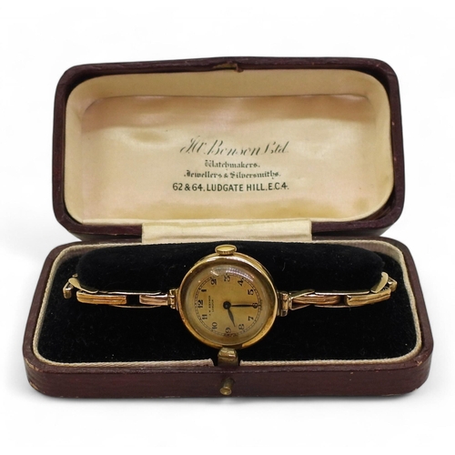 735 - An 18ct gold Bensons ladies watch head, London hallmarks for 1923, with a 9ct gold expanding strap m... 