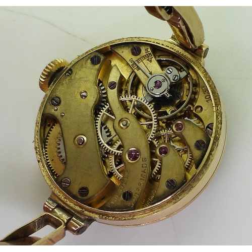 735 - An 18ct gold Bensons ladies watch head, London hallmarks for 1923, with a 9ct gold expanding strap m... 