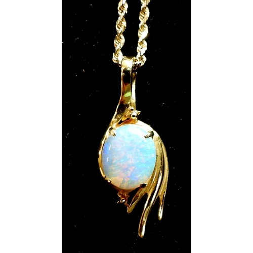 741 - A 14k gold opal pendant with a 46cm, 14k gold rope chain, weight 5.3gms