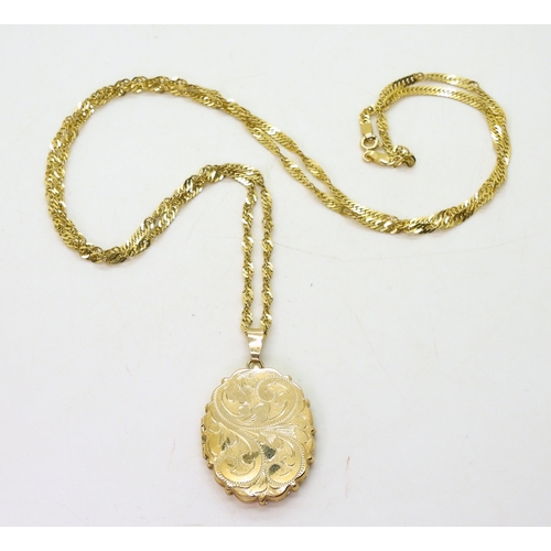 766 - A 9ct gold engraved locket, length with bail 4.5cm, on a 74cm 9ct gold rope chain, weight together 1... 