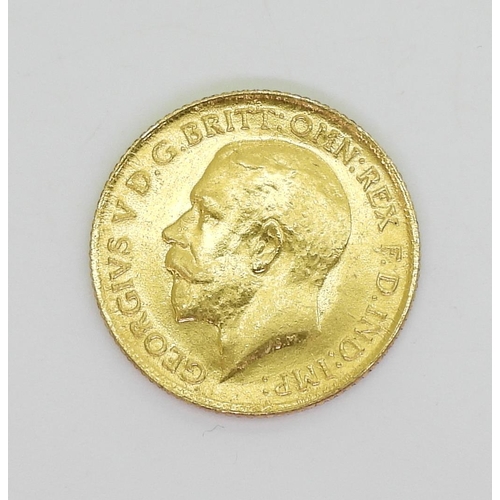 784 - A yellow metal half sovereign 'Re-Strike' with a 9ct gold pendant mount and a46cm neck chain and a m... 