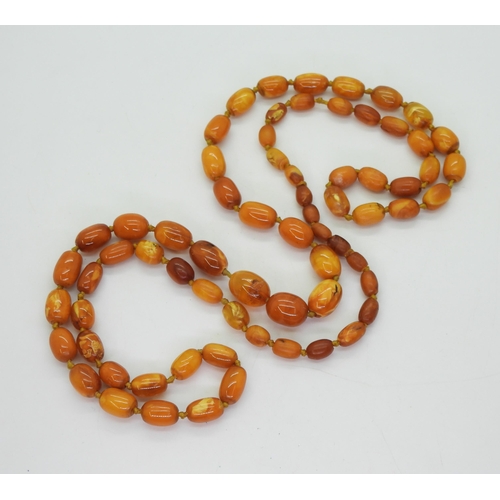 806 - A string of amber coloured beads, largest 15.3mm smallest approx 7.7mm, weight 31.3gms