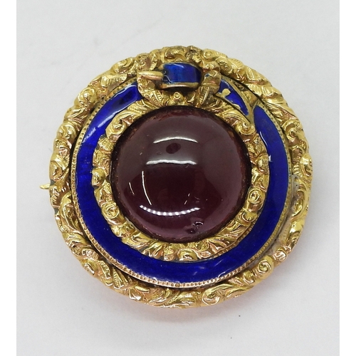 2775 - A MOURNING BROOCHmade in bright yellow metal, with floral engraved and blue enamelled belt design se... 