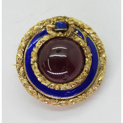 2775 - A MOURNING BROOCHmade in bright yellow metal, with floral engraved and blue enamelled belt design se... 