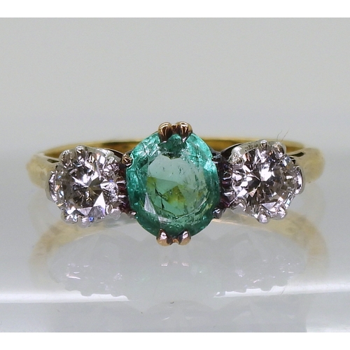 2776 - AN EMERALD & DIAMOND RINGset with a cushion cut emerald of approx 6.5mm x 5.5mm x 3.3mm, and set... 