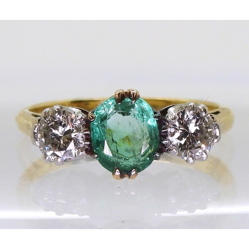 2776 - AN EMERALD & DIAMOND RINGset with a cushion cut emerald of approx 6.5mm x 5.5mm x 3.3mm, and set... 