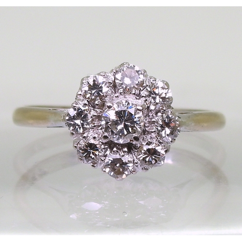 2777 - A DIAMOND FLOWER RINGthe classic galleried mount is set with estimated approx 0.80cts of brilliant c... 